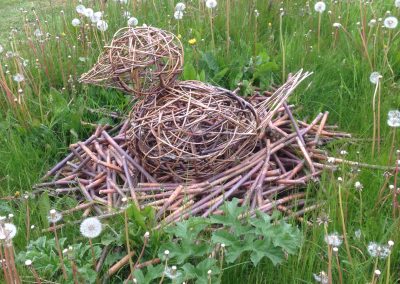 Woven willow bird on its nest at Willows Nursery. Woven willow bulrush decorations using corn dolly weave at Willows Nursery. Buy willow to make.